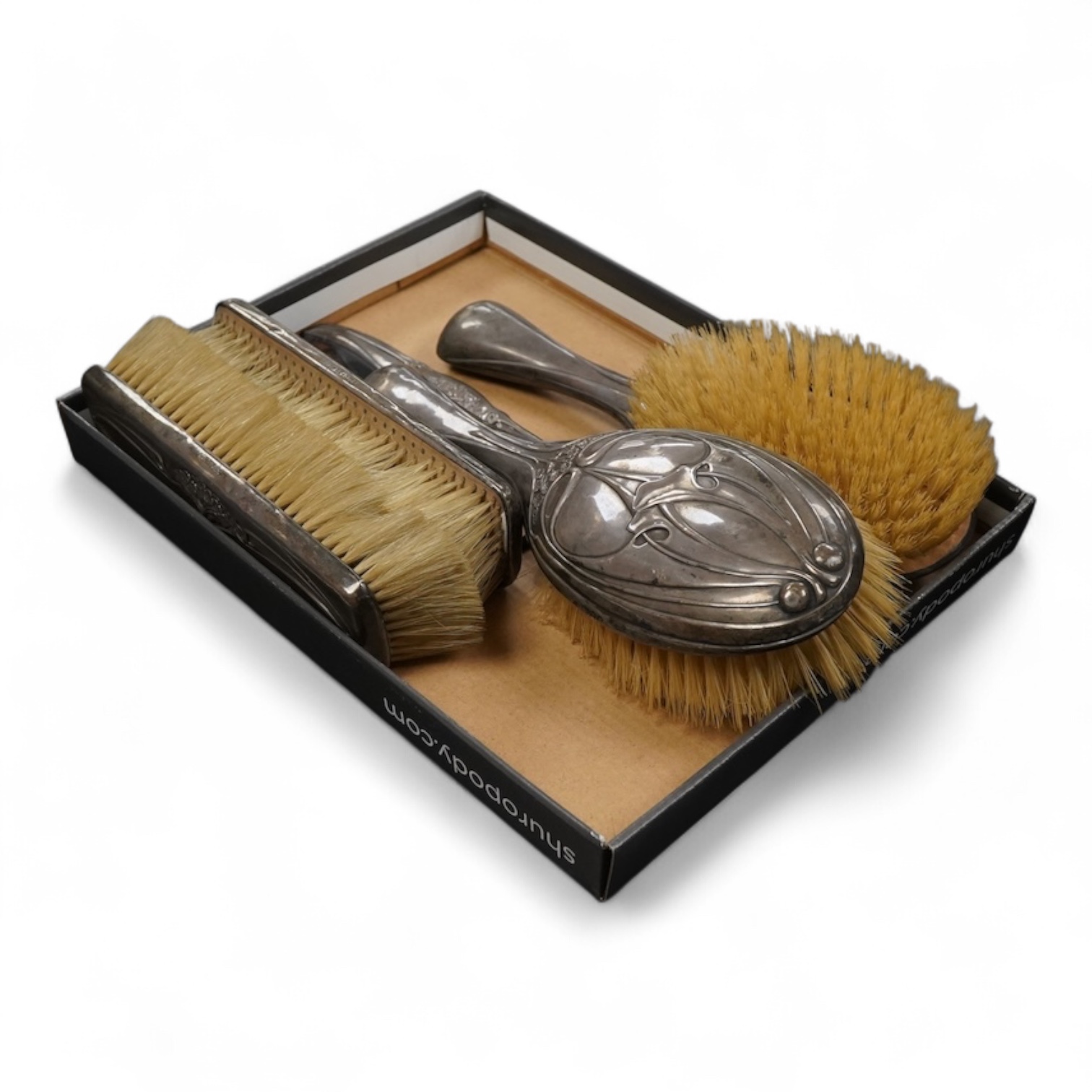 An Art Nouveau Hutton & Son silver mounted five piece dressing table set